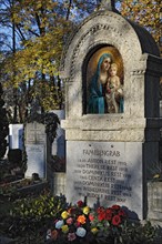 Family grave with mosaic and roses on the Ostfriedhof or East Cemetery