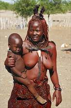 Woman with child in a Himba village