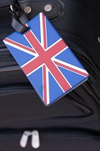 Union Jack luggage tag on a black flight bag