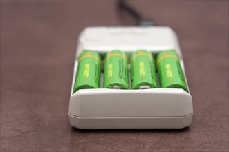 AA rechargable batteries charging in a mains electricity charger