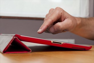 iPad tablet computer in red cover case