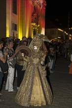 Parade of mask wearers in front of the historic municipal church