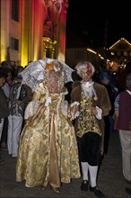 Parade of mask wearers in front of the historic municipal church
