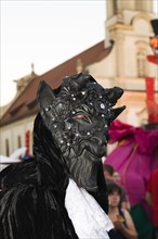 Costume with a devil mask