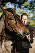 Woman and a Belgian Draft horse