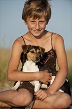 Girl and a Dansk-Svensk Gardshund or Danish-Swedish Farmdog