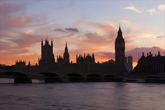 The Houses of Parliament and Westminster Bridge silhouetted at dusk