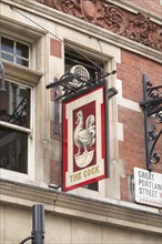 The Cock pub sign in Great Portland Street
