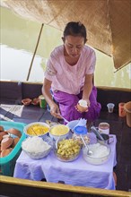 Woman preparing Thai dessert with ice cream