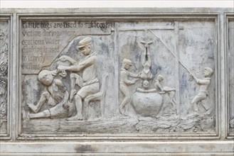 Bas-relief at a memorial monument depicting the atrocities committed by the Khmer Rouge regime