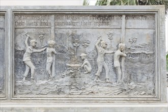 Bas-relief at a memorial monument depicting the atrocities committed by the Khmer Rouge regime