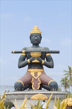 Statue of Ta Dambong with his magic stick