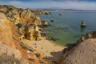 Praia do Camilo beach with Praia Dona Ana beach at back