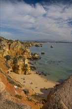 Praia do Camilo beach with Praia Dona Ana beach at back