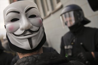 Man wearing a Guy Fawkes mask during a protest against capitalism in Frankfurt