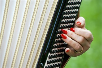 Hand of a female accordion player