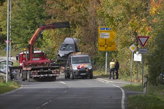 A crashed car is being removed by the ACE
