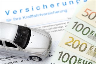 Car insurance contract and miniature car