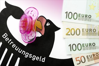 German federal eagle with pacifier and banknotes