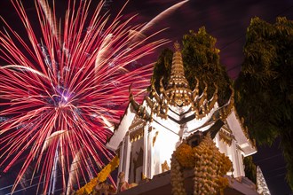 Fireworks behind a Buddhist temple