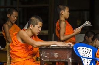 Buddhist monks being taught in a monastery school