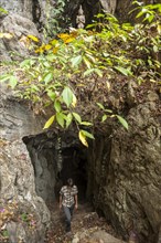 Woman at the entrance to the Buddha cave