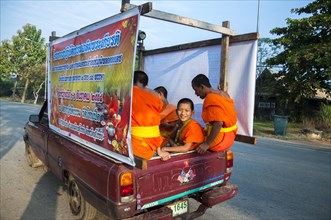 Pickup truck with young Buddhist monks from the monastery school