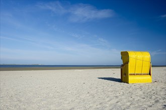 Yellow roofed wicker beach chairs on the beach near Utersum