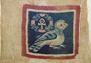 Textile panel depicting a bird with the wreathed cross that takes the form of the pharaonic ankh