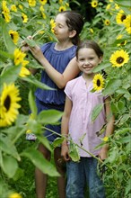 Girls in a sunflower field