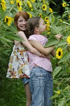 Girls in a sunflower field