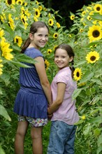 Girls in a sunflower field