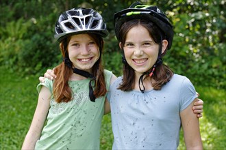 Girls wearing cycle helmets