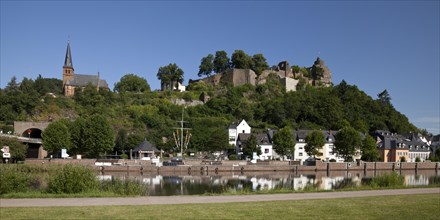 Saar shore with pier and above the Saarburg castle ruins
