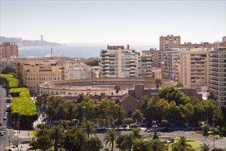 View from Alcazaba Fortress towards the coast with skyscrapers and a bullring