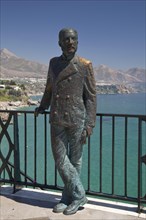 Statue of El Rey Alfonso XII on the observation deck of Balcon de Europa overlooking the beach and coast in Nerja