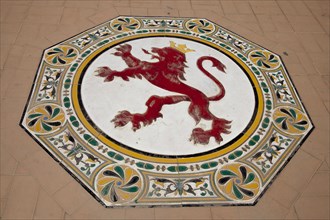 Ceramic figure of a lion on the floor in the Plaza de Espana
