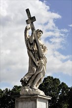 Sculpture of an angel carrying a cross