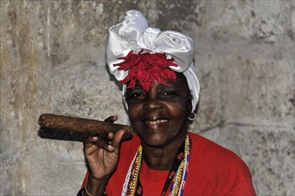 Cuban woman holding a cigar