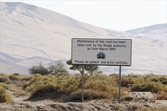 Sign from of the Roads Department in the dune landscape at Sossusvlei