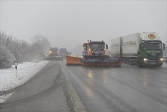Snow-clearing vehicle from the motorway maintenance authorities in operation on the A8 motorway