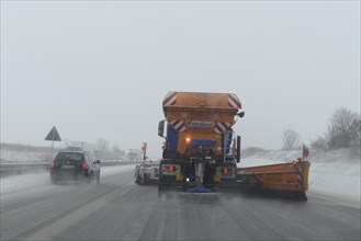 Snow-clearing vehicle from the motorway maintenance authorities in operation on the A8 motorway
