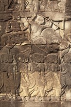 Bas-relief of elephant and soldiers in Khmer temple Bayon