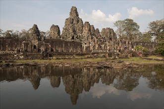 Reflection of Khmer temple in pond