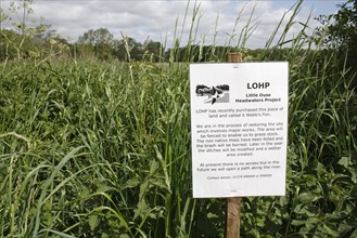 Information sign at recently purchased land for fen habitat restoration project