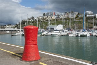 Mooring bollard and yachts in harbour