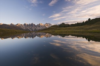 Kalkkoegel mountain range reflected in a small mountain lake