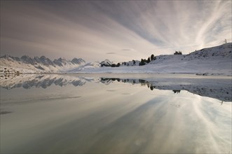 Kalkkoegel mountain range reflected in a small lake