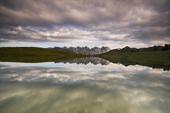 Kalkkoegel mountain range reflected in a small lake