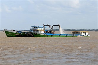 Suction dredger operating on the Mekong River